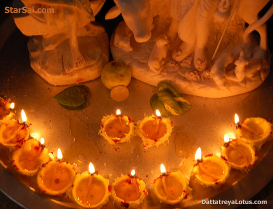 Shirdi Sai baba and Lord Dattatreya in the golden light of lemon lamps